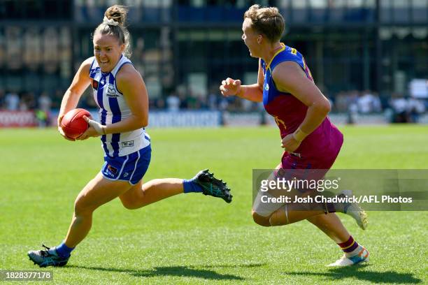 Emma Kearney of the Kangaroos runs with the ball during the AFLW Grand Final match between North Melbourne Tasmania Kangaroos and Brisbane Lions at...
