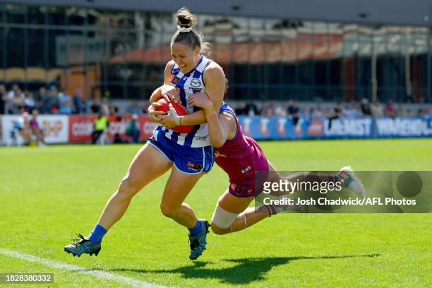 Emma Kearney of the Kangaroos is tackled by Dakota Davidson of the Lions during the AFLW Grand Final match between North Melbourne Tasmania Kangaroos...