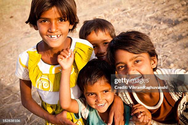 group of cheerful rural indian children in rajasthan - children india stock pictures, royalty-free photos & images