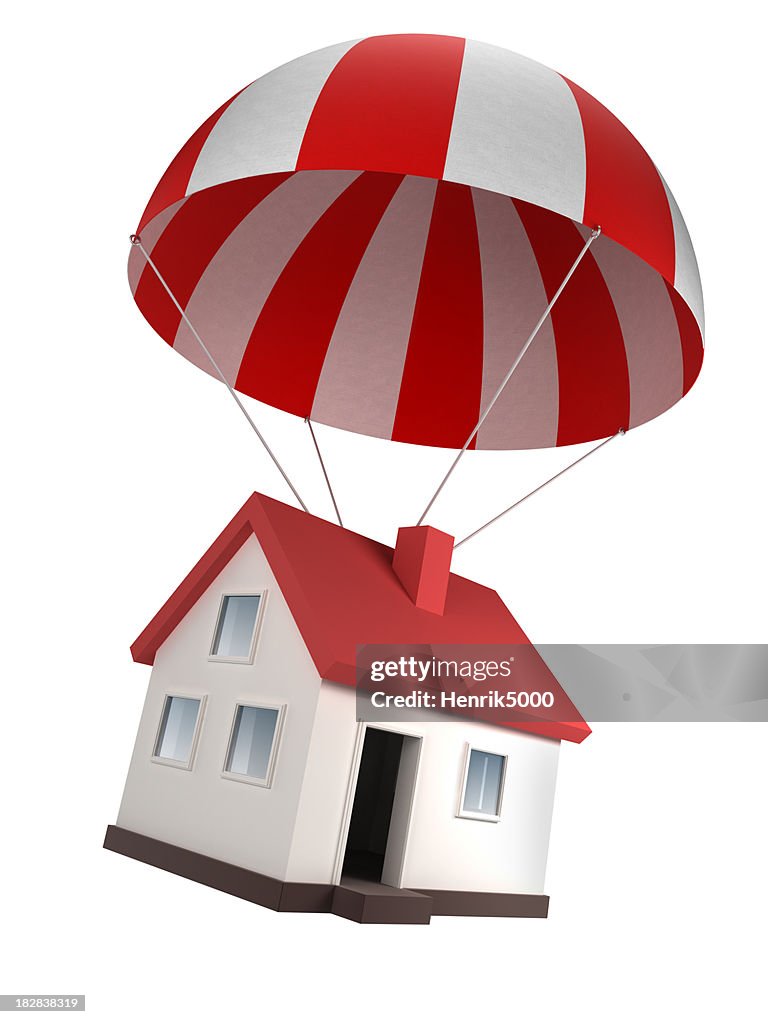 House in parachute - isolated on white with clipping path