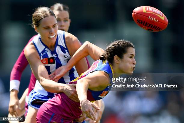 Ally Anderson of the Lions is tackled by Jasmine Garner of the Kangaroos during the AFLW Grand Final match between North Melbourne Tasmania Kangaroos...