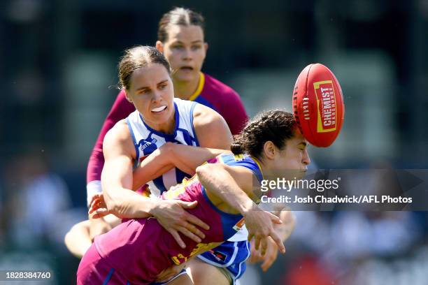 Ally Anderson of the Lions is tackled by Jasmine Garner of the Kangaroos during the AFLW Grand Final match between North Melbourne Tasmania Kangaroos...