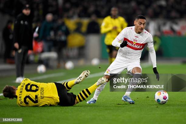 Stuttgart's French midfielder Enzo Millot and Dortmund's Norwegian defender Julian Ryerson vie for the ball during the German Cup round of 16...