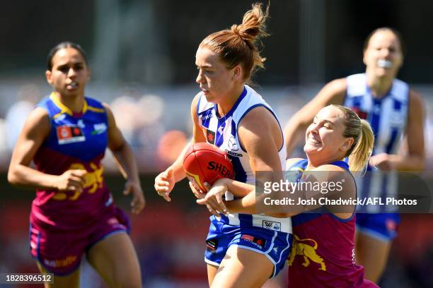 Mia King of the Kangaroos is tackled during the AFLW Grand Final match between North Melbourne Tasmania Kangaroos and Brisbane Lions at Ikon Park, on...