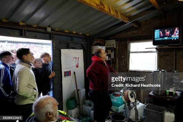 The groundsman and fans are shown watching the Emirates FA Cup Third Round draw prior to the Emirates FA Cup Second Round match between Aldershot...