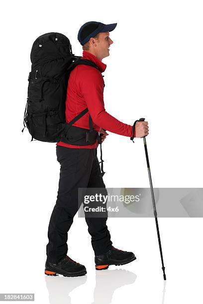 hiker carrying backpack - hiking pole stock pictures, royalty-free photos & images