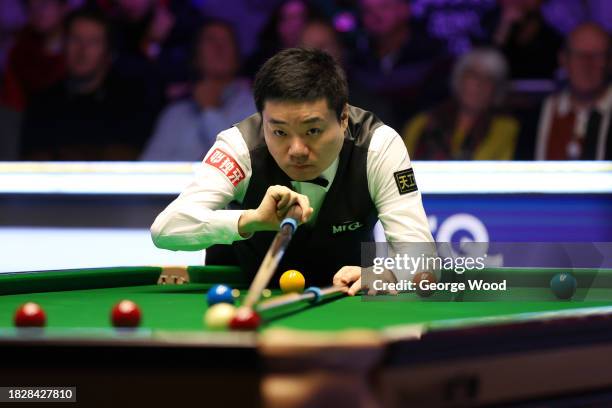 Ding Junhui of China plays a shot against Ronnie O'Sullivan of England in their Final match on Day Nine of the MrQ UK Snooker Championship 2023 at...