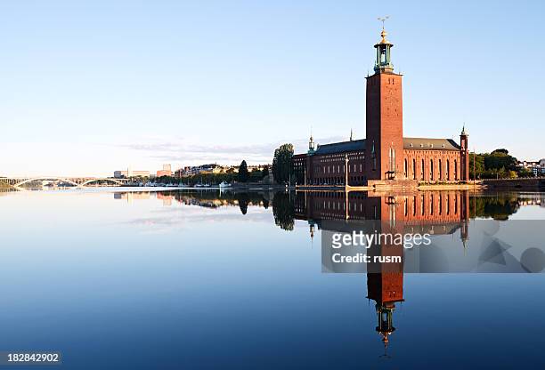 stockholm city hall with reflection on water - stockholm bildbanksfoton och bilder