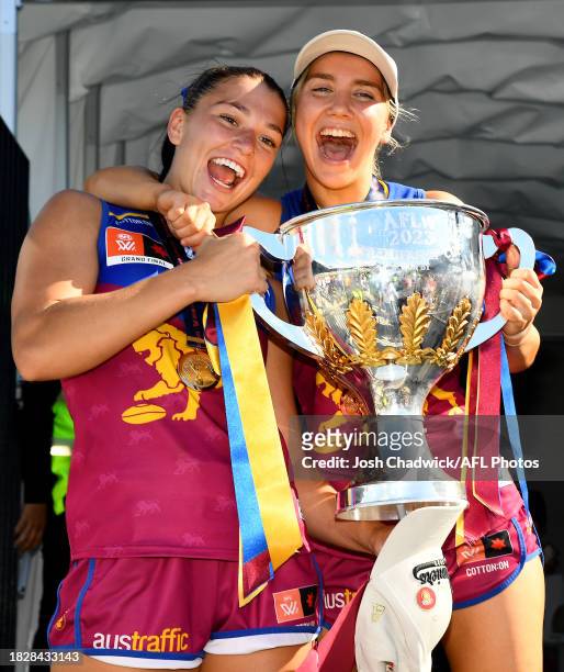 Jade Ellenger and Mikayla Pauga of the Lions celebrate with the premiership cup after winning the AFLW Grand Final match between North Melbourne...