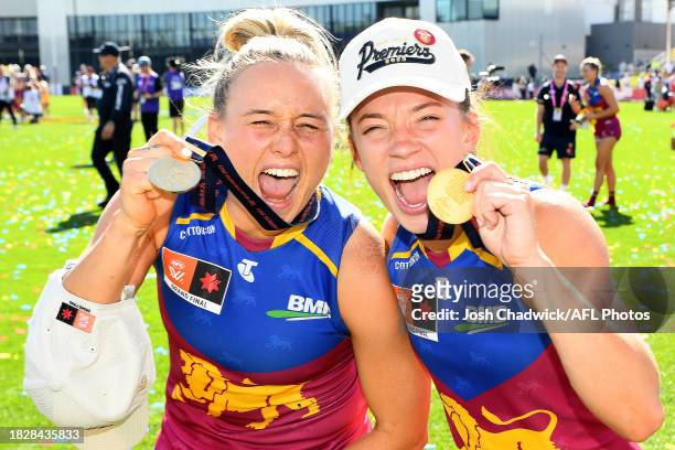 Ellie Hampson and Jade Ellenger of the Lions pose with their premiership medals after winning the AFLW Grand Final match between North Melbourne...