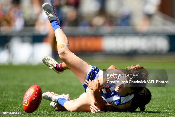 Tess Craven of the Kangaroos is tackled during the AFLW Grand Final match between North Melbourne Tasmania Kangaroos and Brisbane Lions at Ikon Park,...