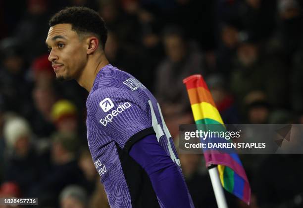 Liverpool's English defender Trent Alexander-Arnold waits to take a corner kick by a rainbow coloured corner-flag during the English Premier League...