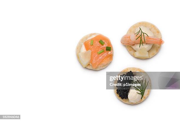 three bite sized appetizers - canape stock pictures, royalty-free photos & images