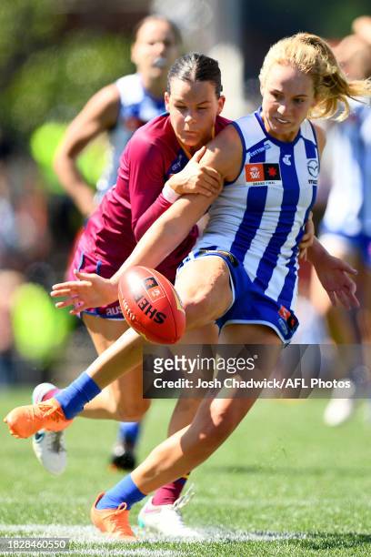 Lulu Pullar of the Kangaroos is tackled by Sophie Conway of the Lions during the AFLW Grand Final match between North Melbourne Tasmania Kangaroos...