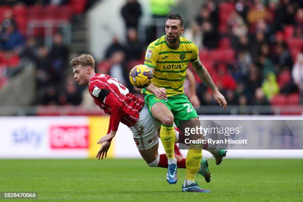 Shane Duffy of Norwich City is challenged by Tommy Conway of Bristol City during the Sky Bet Championship match between Bristol City and Norwich City...