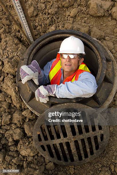 in the sewer - manhole stock pictures, royalty-free photos & images