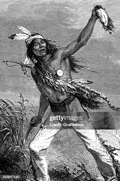 engraving of native american chief cutting scalp 1868 - comanche stock illustrations