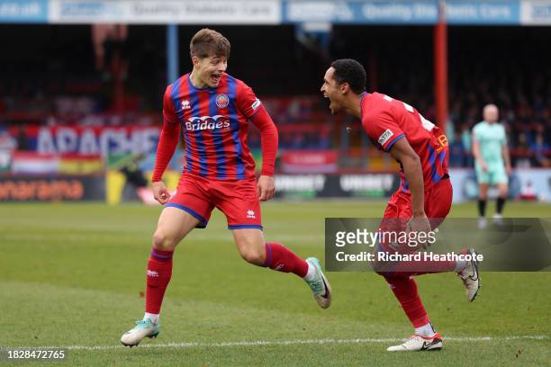 Josh Stokes of Aldershot Town celebrates with teammate Haji Mnoga after scoring the team's second goal during the Emirates FA Cup Second Round match...