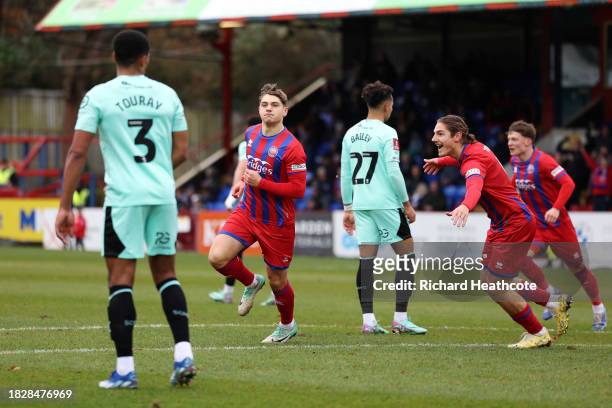 Josh Stokes of Aldershot Town celebrates after scoring the team's first goal during the Emirates FA Cup Second Round match between Aldershot Town and...