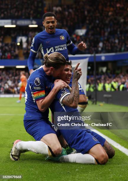 Enzo Fernandez of Chelsea celebrates with teammate Conor Gallagher after scoring the team's first goal during the Premier League match between...