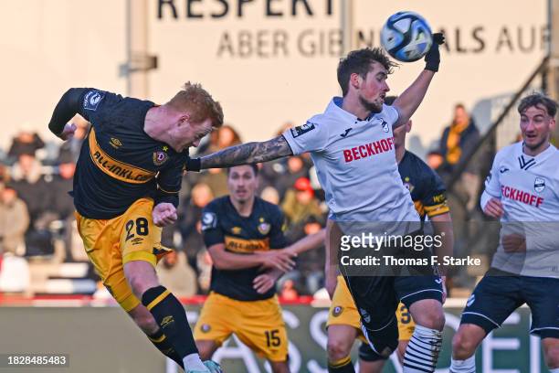 Paul Will of Dresden and Yari Otto of Verl head for the ball during the 3. Liga match between SC Verl and Dynamo Dresden at SPORTCLUB Arena on...