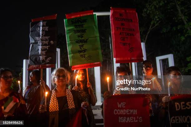 Activists from the social organization 'Bangladesh Stand with Palestine' are holding a candlelight vigil in front of the Central Shaheed Minar...