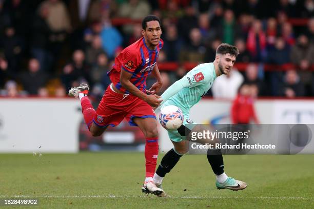 Ethan Pye of Stockport County is challenged by Haji Mnoga of Aldershot Town during the Emirates FA Cup Second Round match between Aldershot Town and...