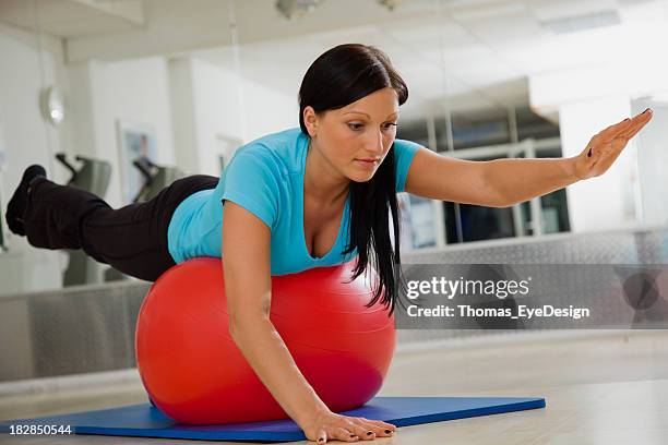 physical therapy with exercies ball - lower back stock pictures, royalty-free photos & images