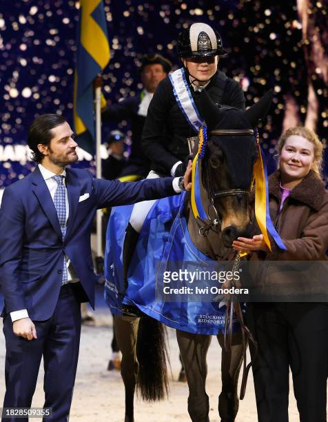 Selma Gustafsson Thelin poses with Prince Carl Philip of Sweden after winning "Prince Carl Philip's Prize 2023" during Sweden International Horse...