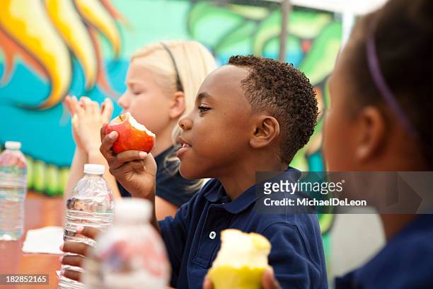 students eating during their lunch break - school lunch stock pictures, royalty-free photos & images
