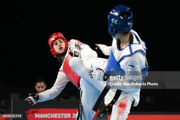 Mengyu Zhang of China competes in the Semi final against Aleksandra Perisic of Serbia in the Female -67kg categoryat Manchester Regional Arena on...