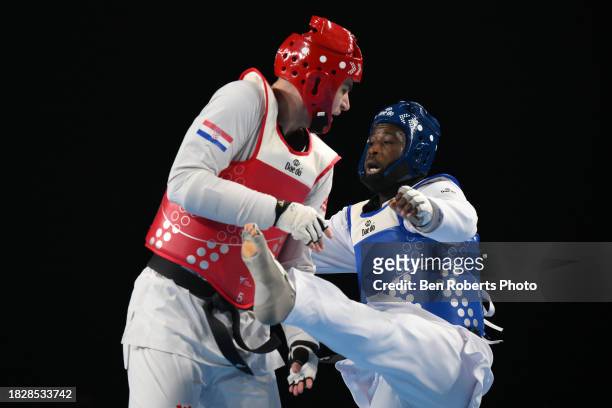 Cheick sallah Cisse of Ivory Coast competes in the Semi final against Pasko Bozic of Croatia in the Male +80kg category at Manchester Regional Arena...