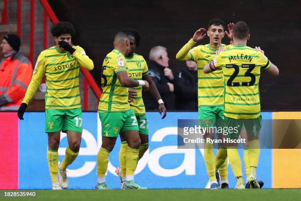 Dimitris Giannoulis of Norwich City celebrates with teammate Kenny McLean of Norwich City after George Tanner of Bristol City scores a own goal...