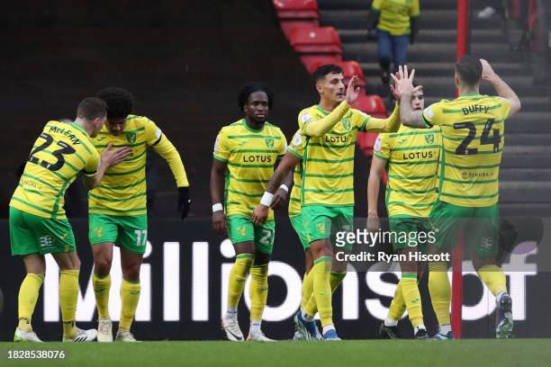 Dimitris Giannoulis of Norwich City celebrates with teammate Shane Duffy of Norwich City after George Tanner of Bristol City scores a own goal during...