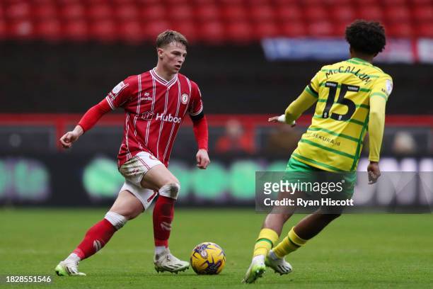 George Tanner of Bristol City runs with the ball under pressure from Sam McCallum of Norwich City during the Sky Bet Championship match between...