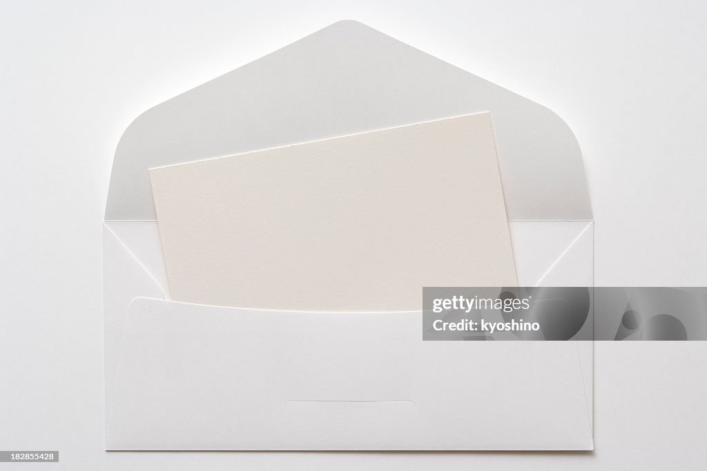 Opened white envelope with blank card on white background