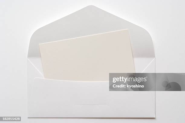 opened white envelope with blank card on white background - envelope stockfoto's en -beelden