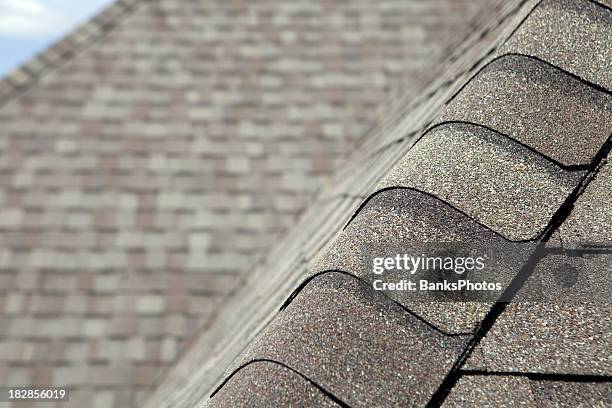 new roof cap leads to valley and blurred shingles - shingle roof stock pictures, royalty-free photos & images