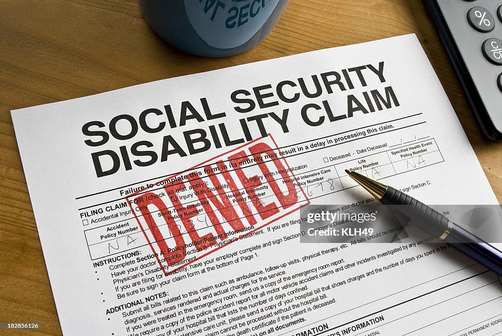 Social Security Claim Denied on a desk