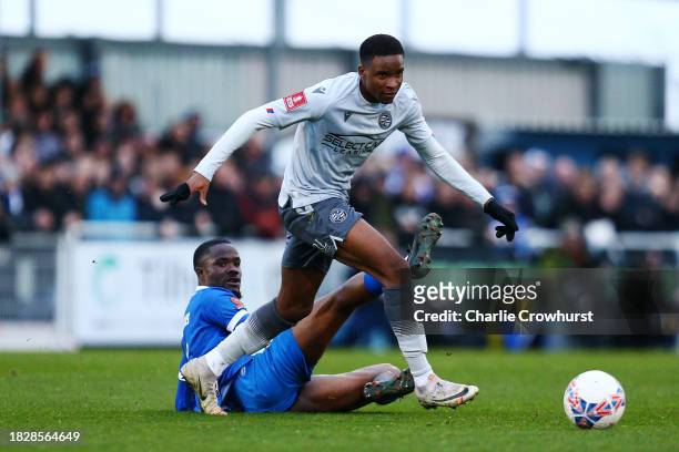 Paul Mukairu of Reading is challenged by Solomon Nwabuokei of Eastleigh during the Emirates FA Cup Second Round match between Eastleigh and Reading...
