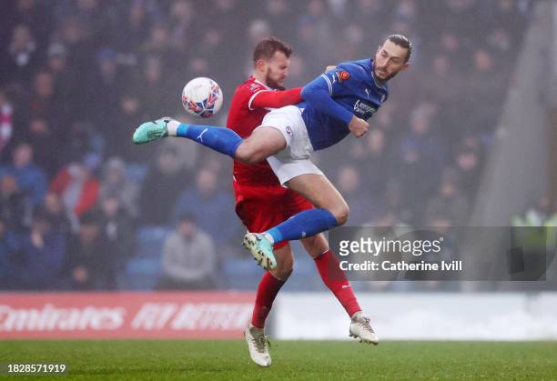 Oliver Banks of Chesterfield is challenged by Thomas James of Eastleigh during the Emirates FA Cup Second Round match between Chesterfield and Leyton...