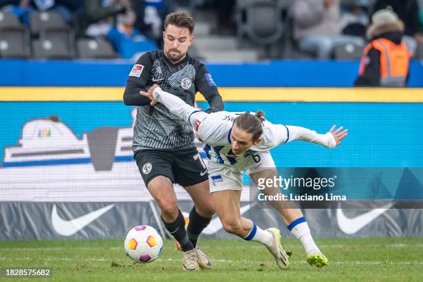 Manuel Feil of SV Elversberg battles for possession with Michał Karbownik of Hertha BSC during the Second Bundesliga match between Hertha BSC and SV...