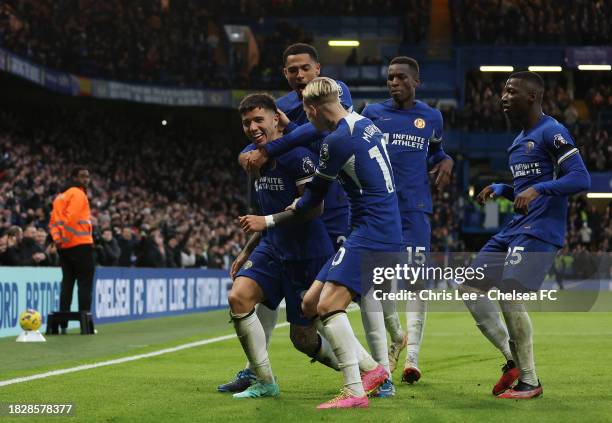 Enzo Fernandez of Chelsea celebrates with teammates after scoring the team's third goal during the Premier League match between Chelsea FC and...