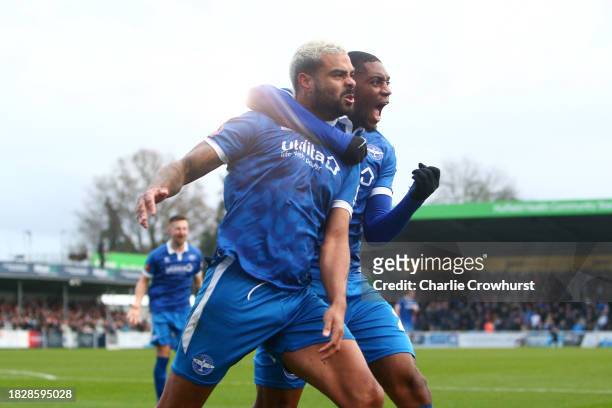 Paul McCallum of Eastleigh celebrates with teammate Jayden Harris of Eastleigh after scoring the team's second goal during the Emirates FA Cup Second...