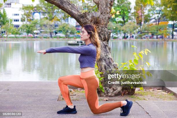 thai transgender doing  in  yoga in park - kathoey stock pictures, royalty-free photos & images