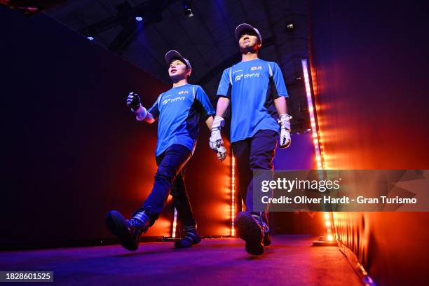 Rikuto Kobayashi and Seiya Suzuki of Japan enter the arena prior to the Nations Cup Final in the Gran Turismo World Series Finals at Fira de...