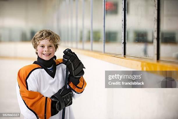 young hockey player - ice hockey equipment stock pictures, royalty-free photos & images