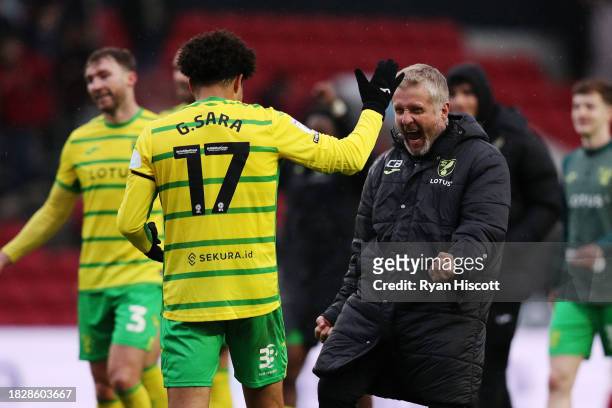 Christoph Buehler, Assistant Coach of Norwich City, celebrates the teams win with Gabriel Sara of Norwich City after the Sky Bet Championship match...