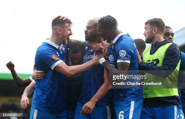 Paul McCallum of Eastleigh celebrates with teammate after scoring the team's second goal during the Emirates FA Cup Second Round match between...