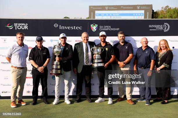 Dean Burmester of South Africa and Altin Van Der Merwe of South Africa pose with winner and leading amateur trophies during day four of the Investec...